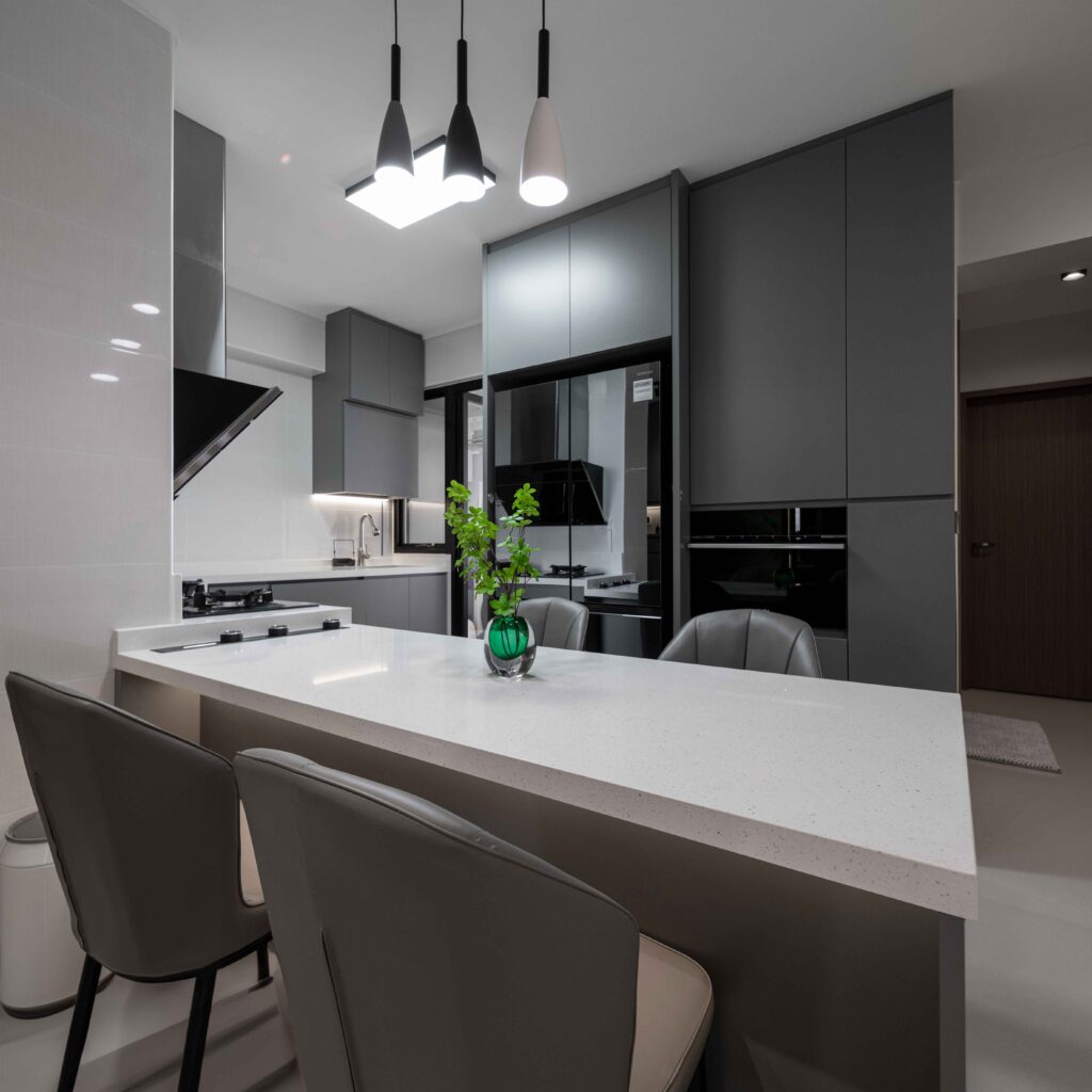 Modern kitchen island with dining table seating | Design 2B Singapore