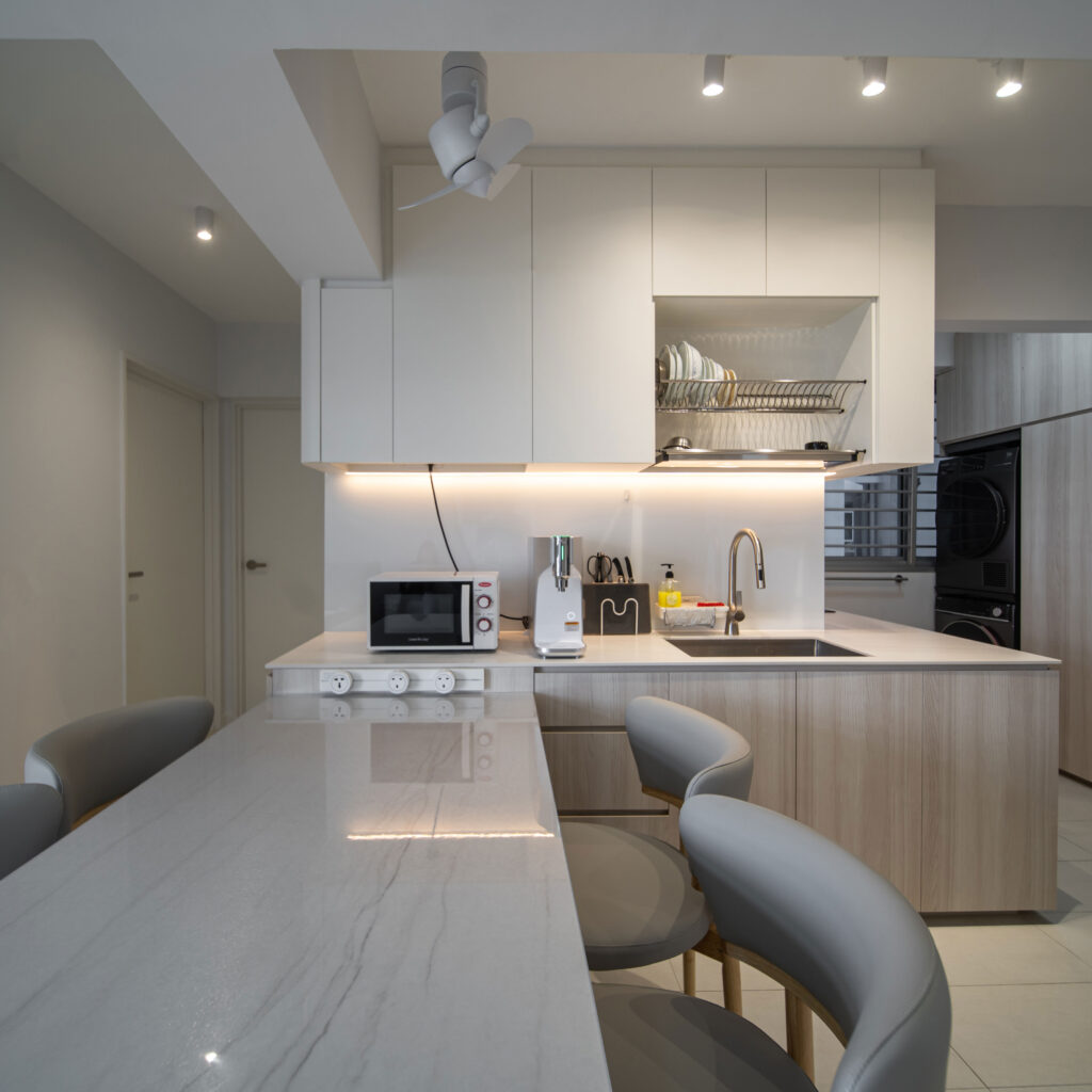 Modern Open-Concept Kitchen with Island by Design 2B at 327 Sumang Walk