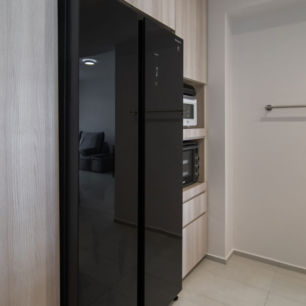 Integrated black fridge storage | Design 2B Singapore