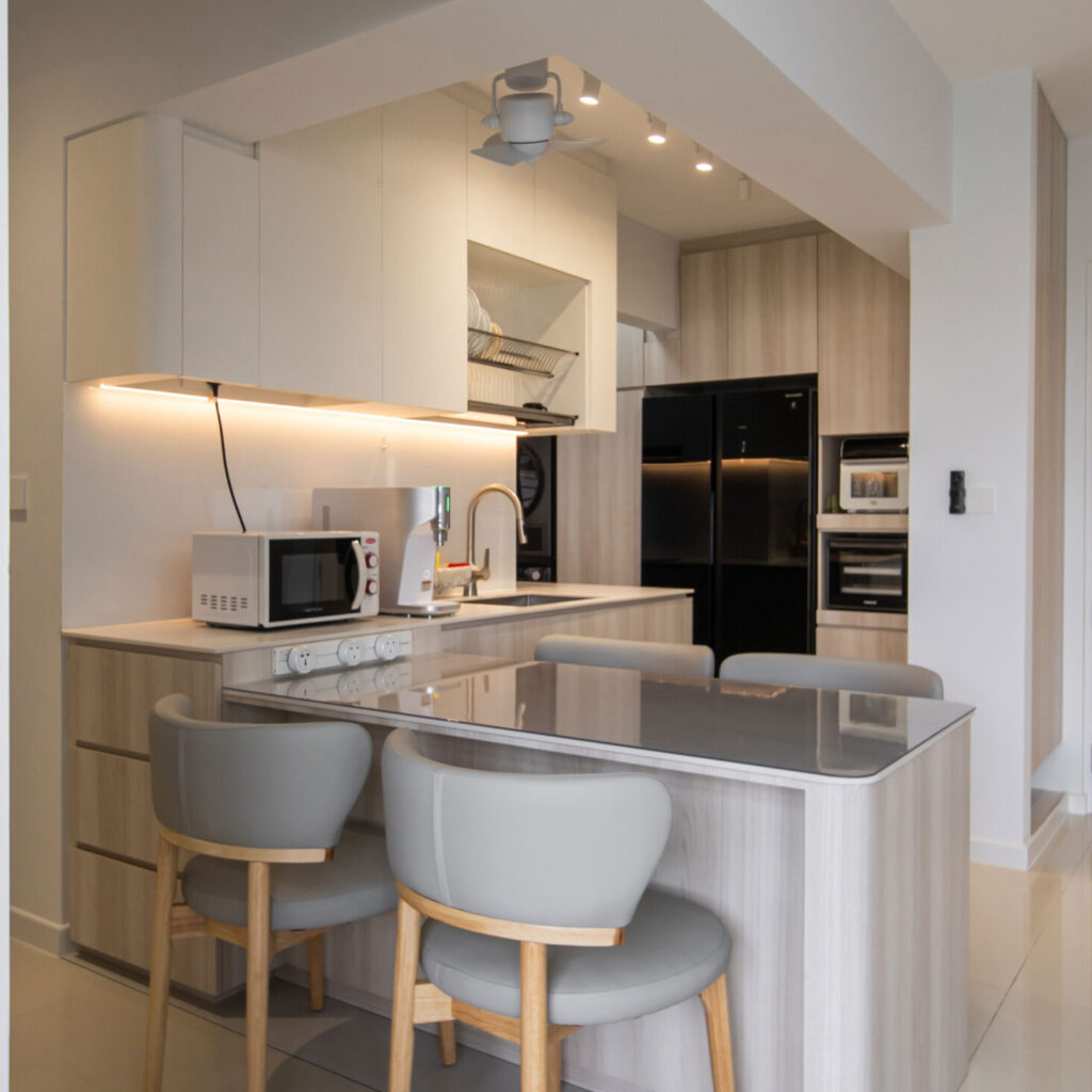 Modern kitchen and dining area interior design in 327 Sumang Walk by Design 2B